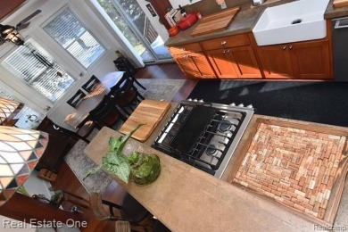 This unique Craftsman-style home offers 1 and a half stories and on Springport Hills Golf Course in Michigan - for sale on GolfHomes.com, golf home, golf lot