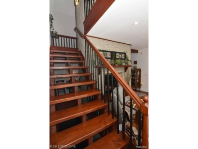 This unique Craftsman-style home offers 1 and a half stories and on Springport Hills Golf Course in Michigan - for sale on GolfHomes.com, golf home, golf lot