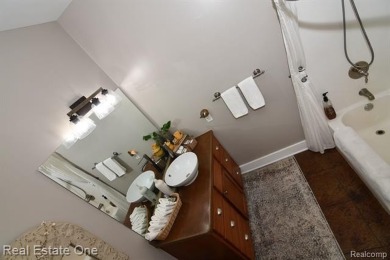 This unique Craftsman-style home offers 1 and a half stories and on Springport Hills Golf Course in Michigan - for sale on GolfHomes.com, golf home, golf lot
