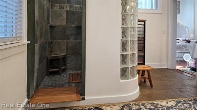 This unique Craftsman-style home offers 1 and a half stories and on Springport Hills Golf Course in Michigan - for sale on GolfHomes.com, golf home, golf lot