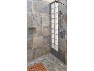 This unique Craftsman-style home offers 1 and a half stories and on Springport Hills Golf Course in Michigan - for sale on GolfHomes.com, golf home, golf lot