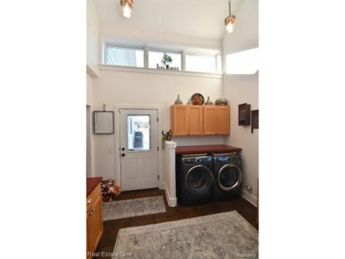 This unique Craftsman-style home offers 1 and a half stories and on Springport Hills Golf Course in Michigan - for sale on GolfHomes.com, golf home, golf lot