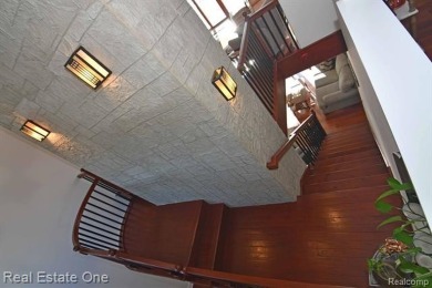 This unique Craftsman-style home offers 1 and a half stories and on Springport Hills Golf Course in Michigan - for sale on GolfHomes.com, golf home, golf lot