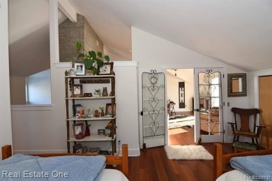 This unique Craftsman-style home offers 1 and a half stories and on Springport Hills Golf Course in Michigan - for sale on GolfHomes.com, golf home, golf lot