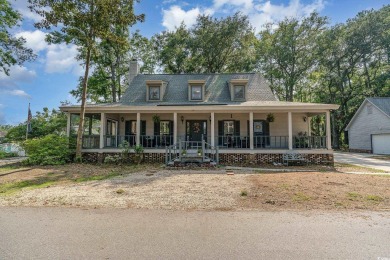 CHECK OUT THIS COZY LOW COUNTRY HOME!!!! This home sits on a on Wedgefield Plantation Golf Club in South Carolina - for sale on GolfHomes.com, golf home, golf lot