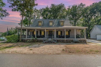 CHECK OUT THIS COZY LOW COUNTRY HOME!!!! This home sits on a on Wedgefield Plantation Golf Club in South Carolina - for sale on GolfHomes.com, golf home, golf lot