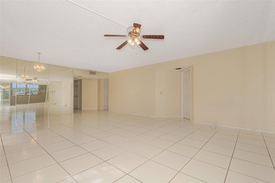 WELL PRICED 1st FLOOR CORNER UNIT in Century Village with 1,507 on Flamingo Lakes Country Club in Florida - for sale on GolfHomes.com, golf home, golf lot
