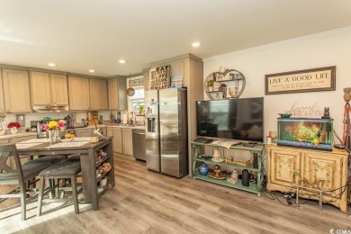 Welcome to Crystal Lake on the border of Surfside Beach and on Prestwick Country Club in South Carolina - for sale on GolfHomes.com, golf home, golf lot