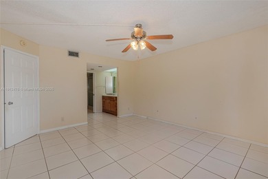 WELL PRICED 1st FLOOR CORNER UNIT in Century Village with 1,507 on Flamingo Lakes Country Club in Florida - for sale on GolfHomes.com, golf home, golf lot