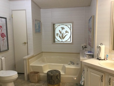 ONE OF THE LARGEST HOMES IN THIS COMMUNITY. THIS 1560 SF HOME IS on Spanish Lakes I in Florida - for sale on GolfHomes.com, golf home, golf lot