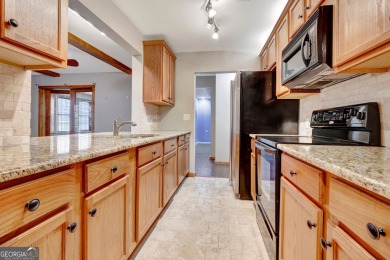 Luxury Golf Course Living with a Fully Finished In-Law Suite on Summergrove Golf Club in Georgia - for sale on GolfHomes.com, golf home, golf lot