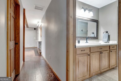 Luxury Golf Course Living with a Fully Finished In-Law Suite on Summergrove Golf Club in Georgia - for sale on GolfHomes.com, golf home, golf lot