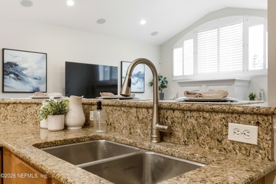 Tucked beneath mature oaks in the gated golf course community of on The Palencia Club in Florida - for sale on GolfHomes.com, golf home, golf lot