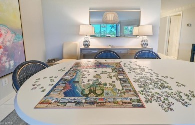 Discover refined coastal living in this rarely available on Club at Pelican Bay Golf Course in Florida - for sale on GolfHomes.com, golf home, golf lot
