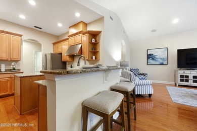 Tucked beneath mature oaks in the gated golf course community of on The Palencia Club in Florida - for sale on GolfHomes.com, golf home, golf lot