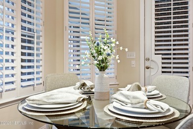 Tucked beneath mature oaks in the gated golf course community of on The Palencia Club in Florida - for sale on GolfHomes.com, golf home, golf lot