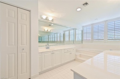 Discover refined coastal living in this rarely available on Club at Pelican Bay Golf Course in Florida - for sale on GolfHomes.com, golf home, golf lot