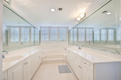 Discover refined coastal living in this rarely available on Club at Pelican Bay Golf Course in Florida - for sale on GolfHomes.com, golf home, golf lot