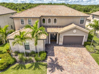 This residence is thoughtfully designed for seamless on Jupiter Country Club in Florida - for sale on GolfHomes.com, golf home, golf lot