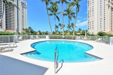 Discover refined coastal living in this rarely available on Club at Pelican Bay Golf Course in Florida - for sale on GolfHomes.com, golf home, golf lot