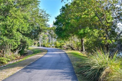 Discover refined coastal living in this rarely available on Club at Pelican Bay Golf Course in Florida - for sale on GolfHomes.com, golf home, golf lot