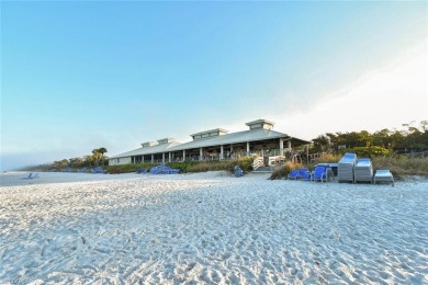 Discover refined coastal living in this rarely available on Club at Pelican Bay Golf Course in Florida - for sale on GolfHomes.com, golf home, golf lot