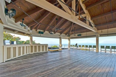 Discover refined coastal living in this rarely available on Club at Pelican Bay Golf Course in Florida - for sale on GolfHomes.com, golf home, golf lot