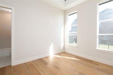 This completed Haynes Homes custom sits on a half-acre lot in on The Bridges Golf Club in Texas - for sale on GolfHomes.com, golf home, golf lot