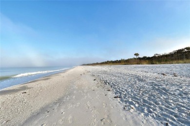 Discover refined coastal living in this rarely available on Club at Pelican Bay Golf Course in Florida - for sale on GolfHomes.com, golf home, golf lot