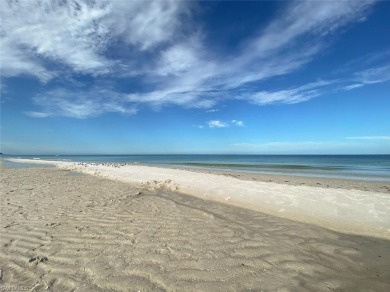 Discover refined coastal living in this rarely available on Club at Pelican Bay Golf Course in Florida - for sale on GolfHomes.com, golf home, golf lot