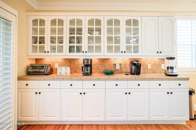 Discover your dream retreat in the prestigious Ocean Creek on Ocean Creek Golf Course in South Carolina - for sale on GolfHomes.com, golf home, golf lot