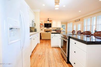 Discover your dream retreat in the prestigious Ocean Creek on Ocean Creek Golf Course in South Carolina - for sale on GolfHomes.com, golf home, golf lot