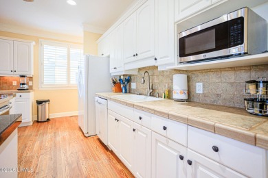 Discover your dream retreat in the prestigious Ocean Creek on Ocean Creek Golf Course in South Carolina - for sale on GolfHomes.com, golf home, golf lot