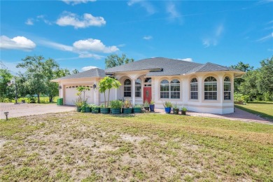 Welcome to your dream home! Nestled on a full acre of land in a on Wedgefield Golf Club in Florida - for sale on GolfHomes.com, golf home, golf lot