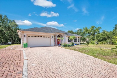 Welcome to your dream home! Nestled on a full acre of land in a on Wedgefield Golf Club in Florida - for sale on GolfHomes.com, golf home, golf lot