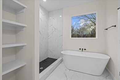 You can't miss this eye-catching new build right off Highway 357 on Woodfin Ridge Golf Club in South Carolina - for sale on GolfHomes.com, golf home, golf lot