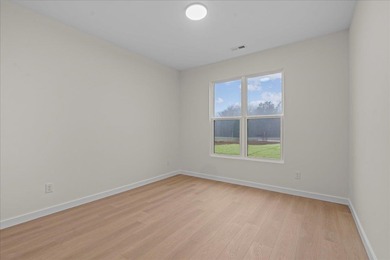 You can't miss this eye-catching new build right off Highway 357 on Woodfin Ridge Golf Club in South Carolina - for sale on GolfHomes.com, golf home, golf lot