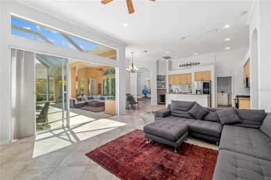 Discover this stunning 4-bedroom, 3-bathroom Neal Built home on University Park Country Club in Florida - for sale on GolfHomes.com, golf home, golf lot