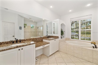 Discover this stunning 4-bedroom, 3-bathroom Neal Built home on University Park Country Club in Florida - for sale on GolfHomes.com, golf home, golf lot