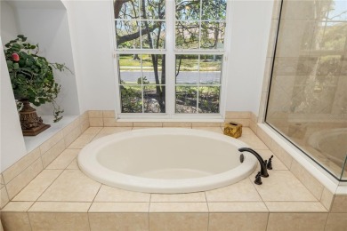 Discover this stunning 4-bedroom, 3-bathroom Neal Built home on University Park Country Club in Florida - for sale on GolfHomes.com, golf home, golf lot