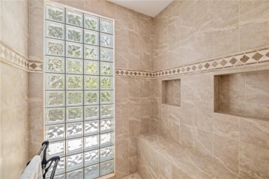 Discover this stunning 4-bedroom, 3-bathroom Neal Built home on University Park Country Club in Florida - for sale on GolfHomes.com, golf home, golf lot