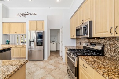 Discover this stunning 4-bedroom, 3-bathroom Neal Built home on University Park Country Club in Florida - for sale on GolfHomes.com, golf home, golf lot