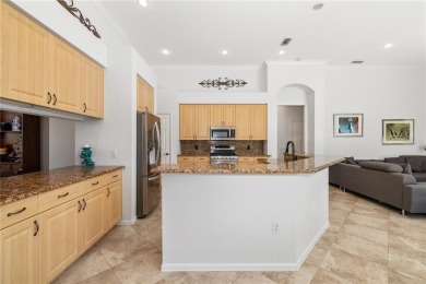 Discover this stunning 4-bedroom, 3-bathroom Neal Built home on University Park Country Club in Florida - for sale on GolfHomes.com, golf home, golf lot