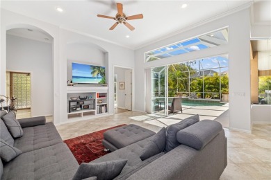 Discover this stunning 4-bedroom, 3-bathroom Neal Built home on University Park Country Club in Florida - for sale on GolfHomes.com, golf home, golf lot