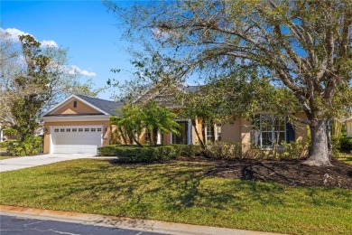 Discover this stunning 4-bedroom, 3-bathroom Neal Built home on University Park Country Club in Florida - for sale on GolfHomes.com, golf home, golf lot