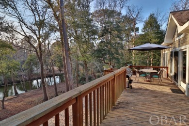 Welcome to your private oasis nestled in the serene woods on Duck Woods Country Club in North Carolina - for sale on GolfHomes.com, golf home, golf lot