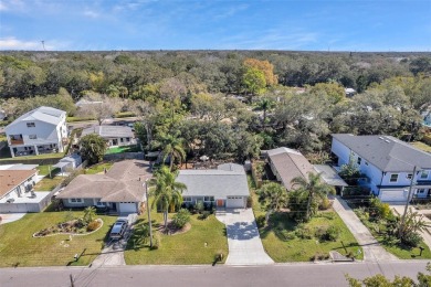 Property is located in a golf cartable neighborhood across the on The Dunedin Country Club in Florida - for sale on GolfHomes.com, golf home, golf lot