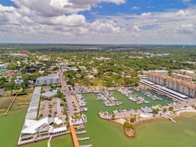 Property is located in a golf cartable neighborhood across the on The Dunedin Country Club in Florida - for sale on GolfHomes.com, golf home, golf lot
