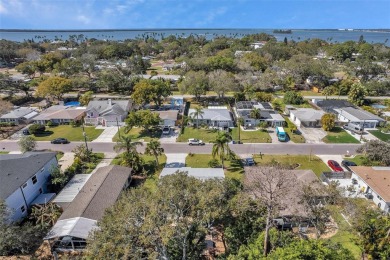 Property is located in a golf cartable neighborhood across the on The Dunedin Country Club in Florida - for sale on GolfHomes.com, golf home, golf lot