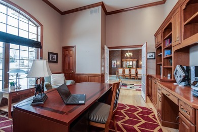 Situated along Hawk's Landing's premier fairway, this custom on Hawks Landing Golf Club in Wisconsin - for sale on GolfHomes.com, golf home, golf lot